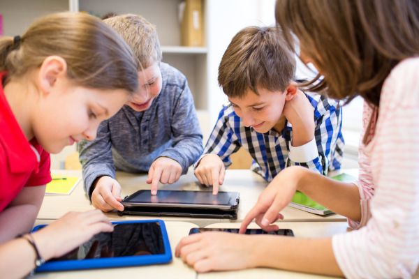 children using tablet computers at school