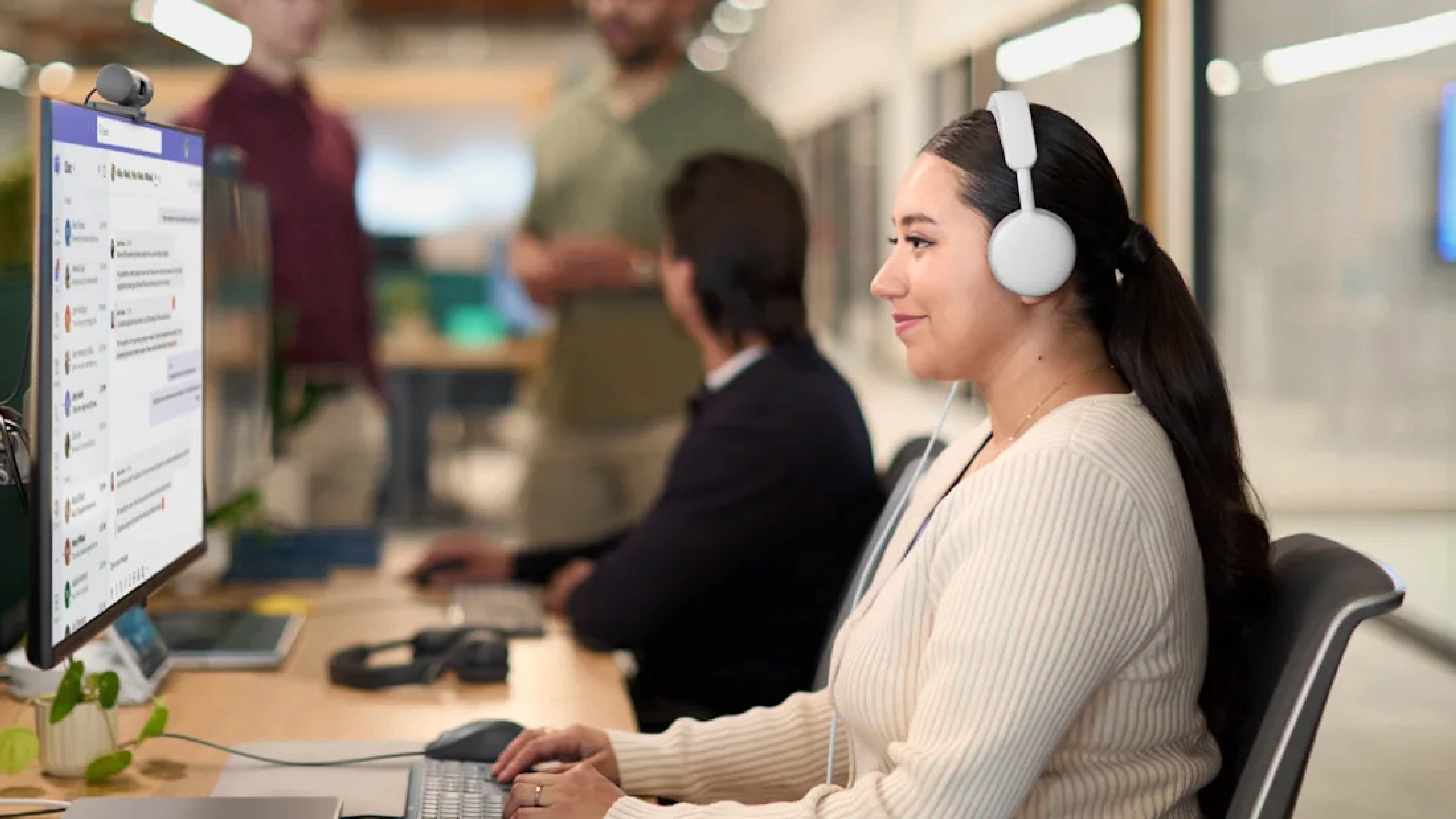 Product Image of someone using Logitech Zone Wired 2 headphones in the workplace